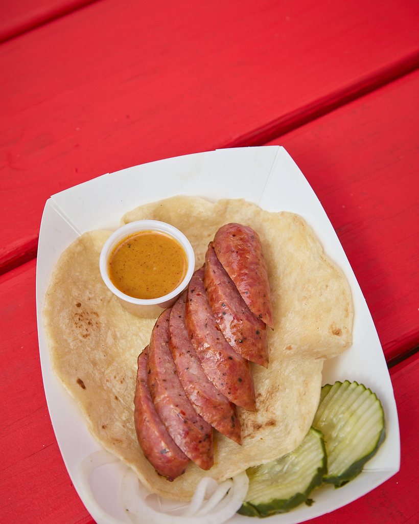 The Journeyman breakfast taco with a jalapeƱo cheese sausage link